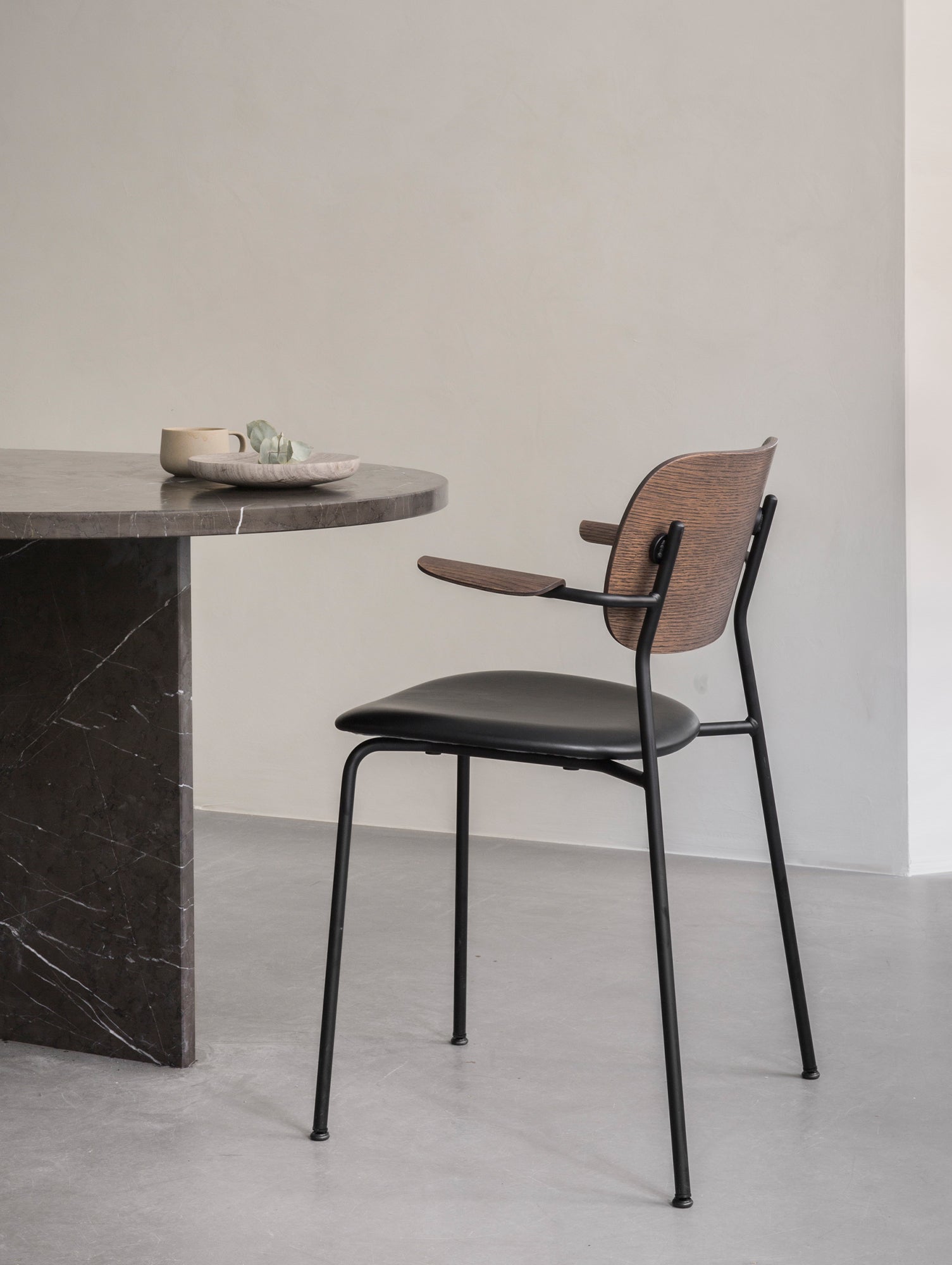 Co Dining Chair Upholstered by Menu - With Armrest / Black Powder Coated Steel / Dark Oak / Dakar Black Leather