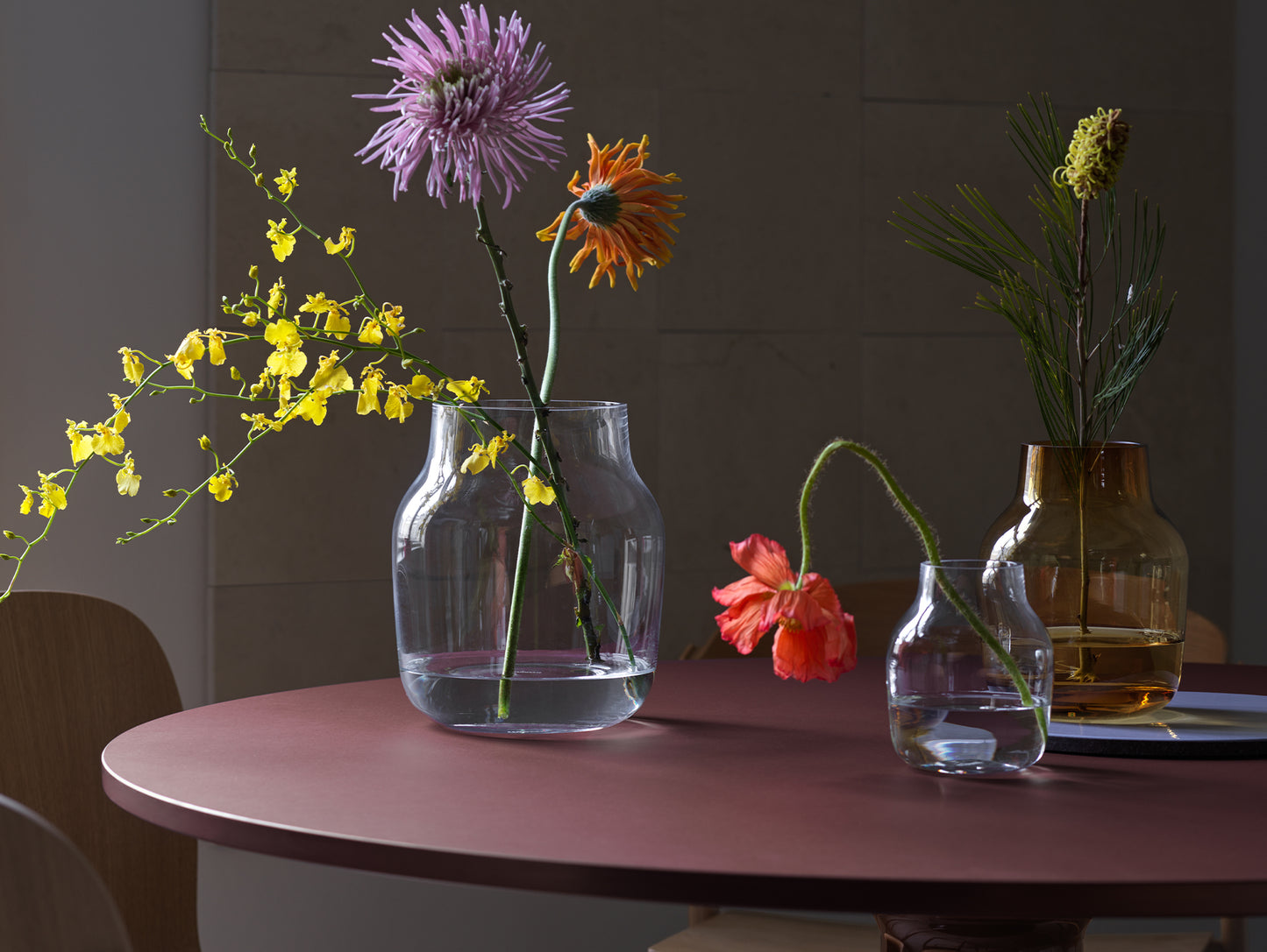 Midst Table by Muuto - Diameter: 120 cm / Dark Red Linoleum Tabletop with Dark Red Steel Base
