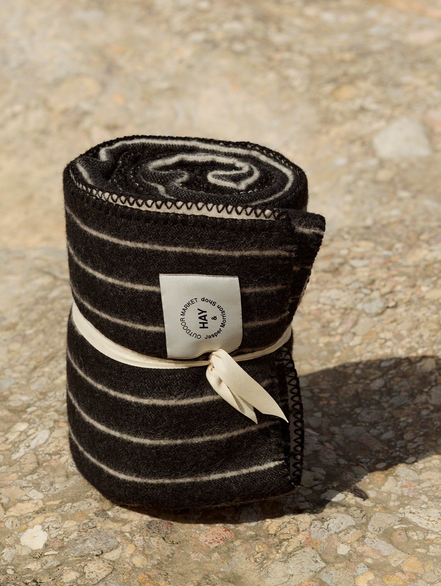 Outdoor Market Throw by HAY - Black with Beige Stripe