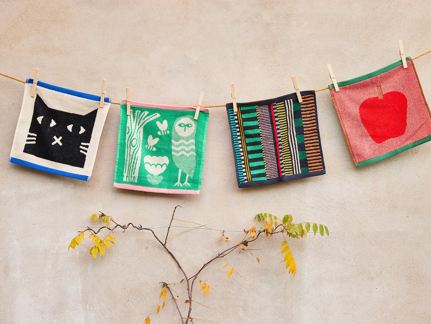 Lazy Cat Face Towel by Donna Wilson